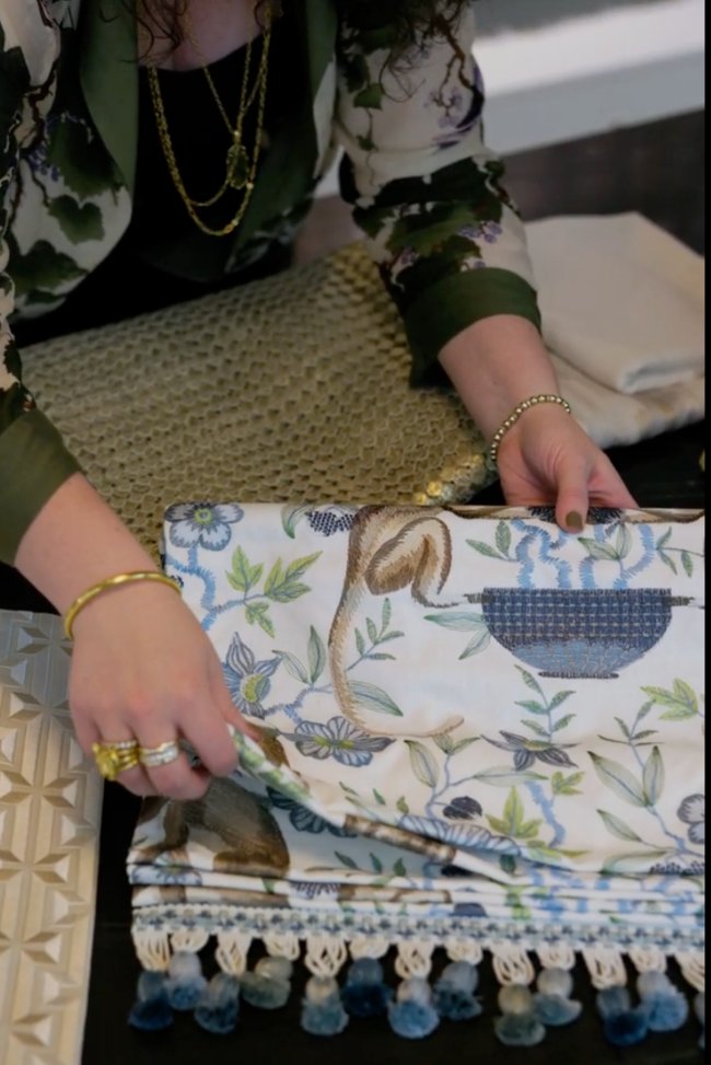 A Woman Checking Custom Drapery and Fabric at The Great Curtain Company