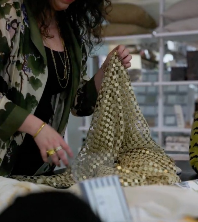A Woman Holding a Fabric During the Sourcing Process at The Great Curtain Company