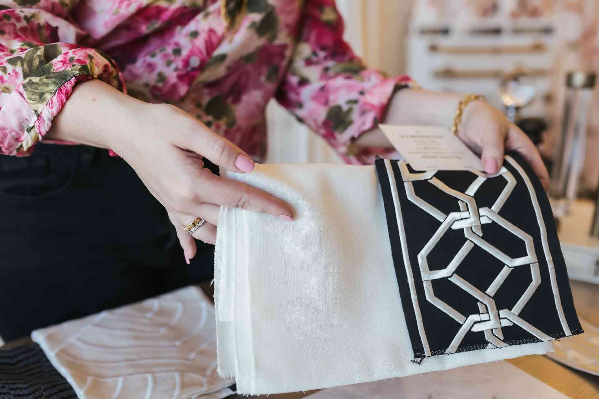 Interior designer reviewing decorative fabric samples in Austin, TX